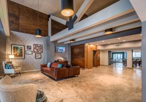 a large living room with a couch and chairs at Four Points by Sheraton Anchorage Downtown in Anchorage