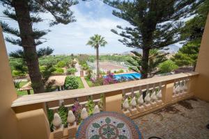 a balcony with a view of a resort at B&B Villa Amodeo in Paceco