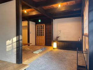 Llit o llits en una habitació de 伊風ifu貸切一棟宿
