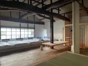 Llit o llits en una habitació de 伊風ifu貸切一棟宿