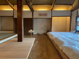 Llit o llits en una habitació de 伊風ifu貸切一棟宿