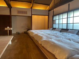 Llit o llits en una habitació de 伊風ifu貸切一棟宿