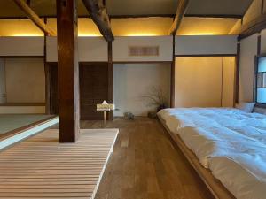 Llit o llits en una habitació de 伊風ifu貸切一棟宿