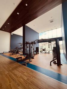 a gym with several treadmills and exercise equipment in a room at Camino al Mar in Mazatlán