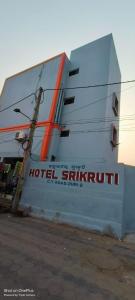 a building with a hotel suffix on the side of it at SRIKRUTI SEA VIEW in Puri