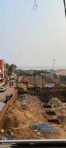 a construction site with dirt and rubble and a street at SRIKRUTI SEA VIEW in Puri