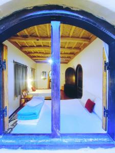 a bedroom with two beds in a room at Riad pizzeria Marhaba in Akhendachou nʼAït Ouffi