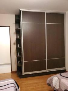 a large closet in a room with wooden floors at Apartamentos La Floresta in Cochabamba