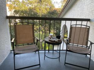 two chairs and a table on a balcony at Great Apt Close Disney Spring in Orlando