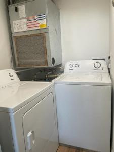 a kitchen with a stove and a washer and dryer at Great Apt Close Disney Spring in Orlando