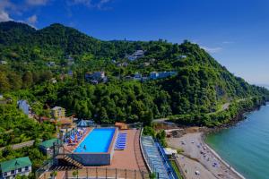 an aerial view of a resort with a swimming pool and a beach at Kvariati Panorama in Kvariati