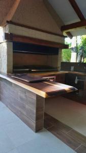 a kitchen with a counter top in a room at Casa de Campo in Santa Cruz de la Sierra