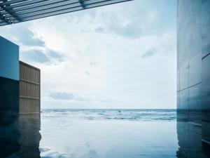 a view of the ocean from a swimming pool at Yunohama Hotel in Hakodate