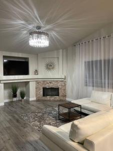 a living room with a couch and a fireplace at Sweet Holiday in Antelope