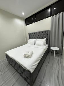 Llit o llits en una habitació de Kristinas Aparthotel Kabankalan