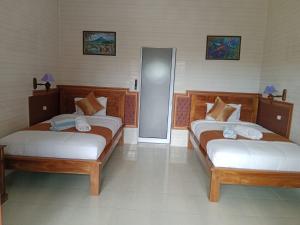 Postel nebo postele na pokoji v ubytování Grace Paradise Guest House
