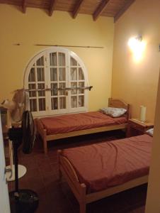 Ένα ή περισσότερα κρεβάτια σε δωμάτιο στο Casa ABUELO WILSON Santa Teresita