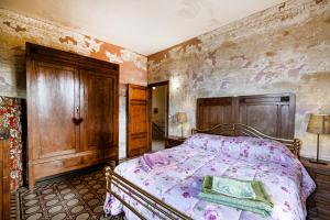 Giường trong phòng chung tại Casa Giovanni - Relax Among Greenery - Happy Rentals