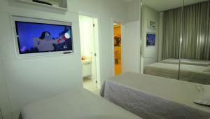 Postel nebo postele na pokoji v ubytování 1072 - Apartamento 3 suítes Alto Padrão com SPA na Praia de Bombinhas