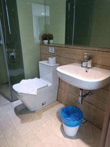 a bathroom with a toilet and a sink at vortex klcc RR in Kuala Lumpur