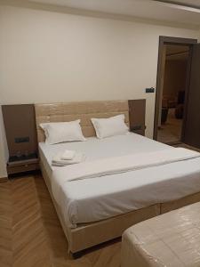 Postel nebo postele na pokoji v ubytování Prakhyat