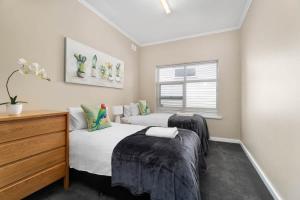 Ένα ή περισσότερα κρεβάτια σε δωμάτιο στο Bellevue Heights HolidayHome - Flinders Uni & Med