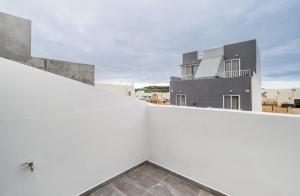 a view from the balcony of a white building at Penthouse in St. Paul's Bay in St Paul's Bay