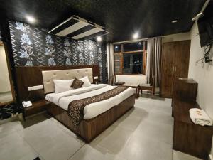 a bedroom with a bed with a cheetah print wall at Shimla Royale - Mountain Zest in Shimla