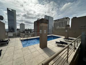 a swimming pool on the roof of a building at Av Julio A Roca - Monserrat in Buenos Aires