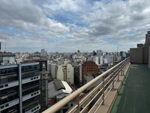 a view of a city from the balcony of a building at Av Julio A Roca - Monserrat in Buenos Aires