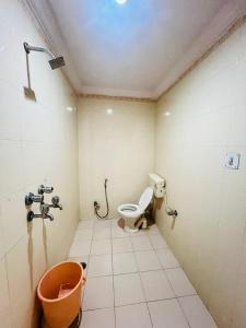a bathroom with a toilet and a sink at Hotel Payal Jaisalmer in Jaisalmer