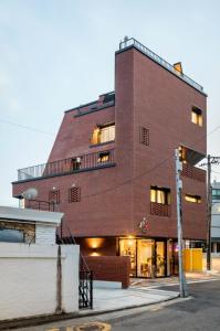 a red brick building on a street corner at Space in Blackstone in Seoul