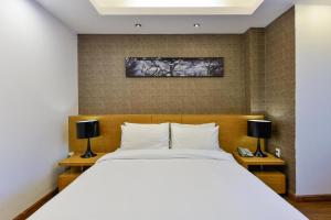 Giường trong phòng chung tại Nicecy Hotel - Nguyen Trai Street