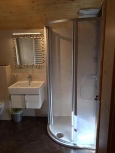 a bathroom with a shower and a sink at Bauernhof Sinnersberg in Kitzbühel