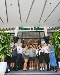 a group of people standing in front of a store at Sofiana My Khe Hotel & Spa- Rooftop Pool Bar in Danang