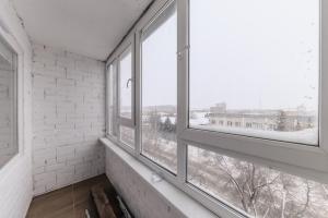 Balkón nebo terasa v ubytování Фирменная квартира c домашним кинотеатром ЦУМ