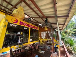 a restaurant with tables and chairs in front of it at Moondance Cottage Inn in Ko Chang