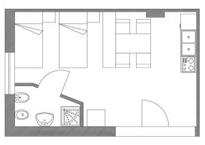 een plattegrond van een huis bij Monolocale 3 letti con cucina e parcheggio gratuito in Candela