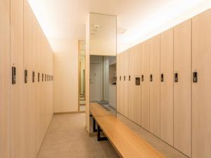 a row of lockers in a locker room at Glansit Kyoto Kawaramachi in Kyoto