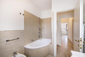 a bathroom with a tub and a sink at Casa al Ponte dei Marmi - few KM to sea - Happy Rentals in Seravezza +17 photos