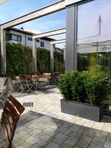 a group of chairs and tables in front of a building at HGS&sup3; in Schelklingen