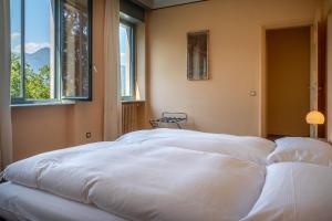 Ein Bett oder Betten in einem Zimmer der Unterkunft Hotel Monte Verità