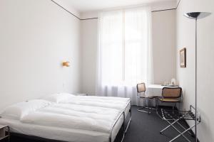 Ein Bett oder Betten in einem Zimmer der Unterkunft Hotel Monte Verità