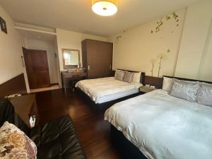 Giường trong phòng chung tại Siangting B&B