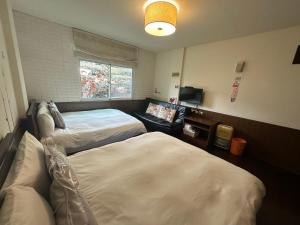 Giường trong phòng chung tại Siangting B&B