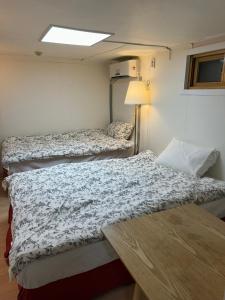 Ένα ή περισσότερα κρεβάτια σε δωμάτιο στο G Mini Hotel Dongdaemun +68 φωτογραφίες