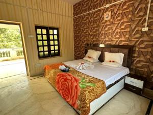 a bedroom with a bed with a wooden wall at Divine palace in Vrindāvan