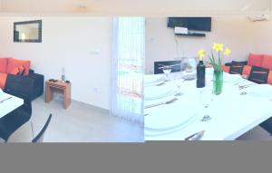 Televízia a/alebo spoločenská miestnosť v ubytovaní Four-Bedroom Holiday Home In Lecevica