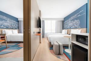 Postel nebo postele na pokoji v ubytování Holiday Inn Express Rayong