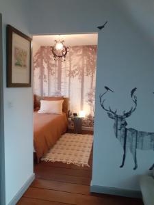 Postel nebo postele na pokoji v ubytování Le Verger (Le Plessis)